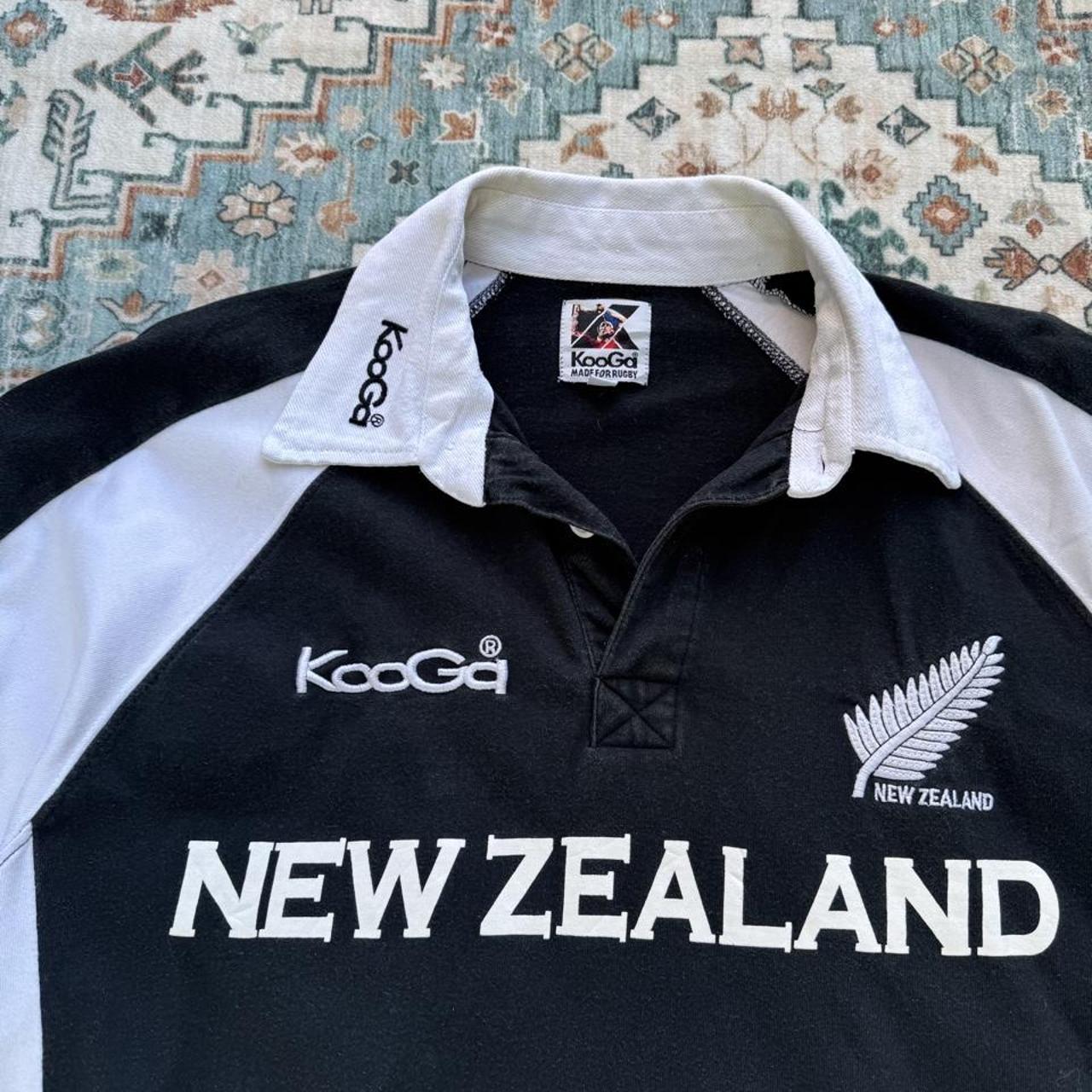 Kooga men's polo shirt, green with embroidered New Zealand logo and rugby collar.