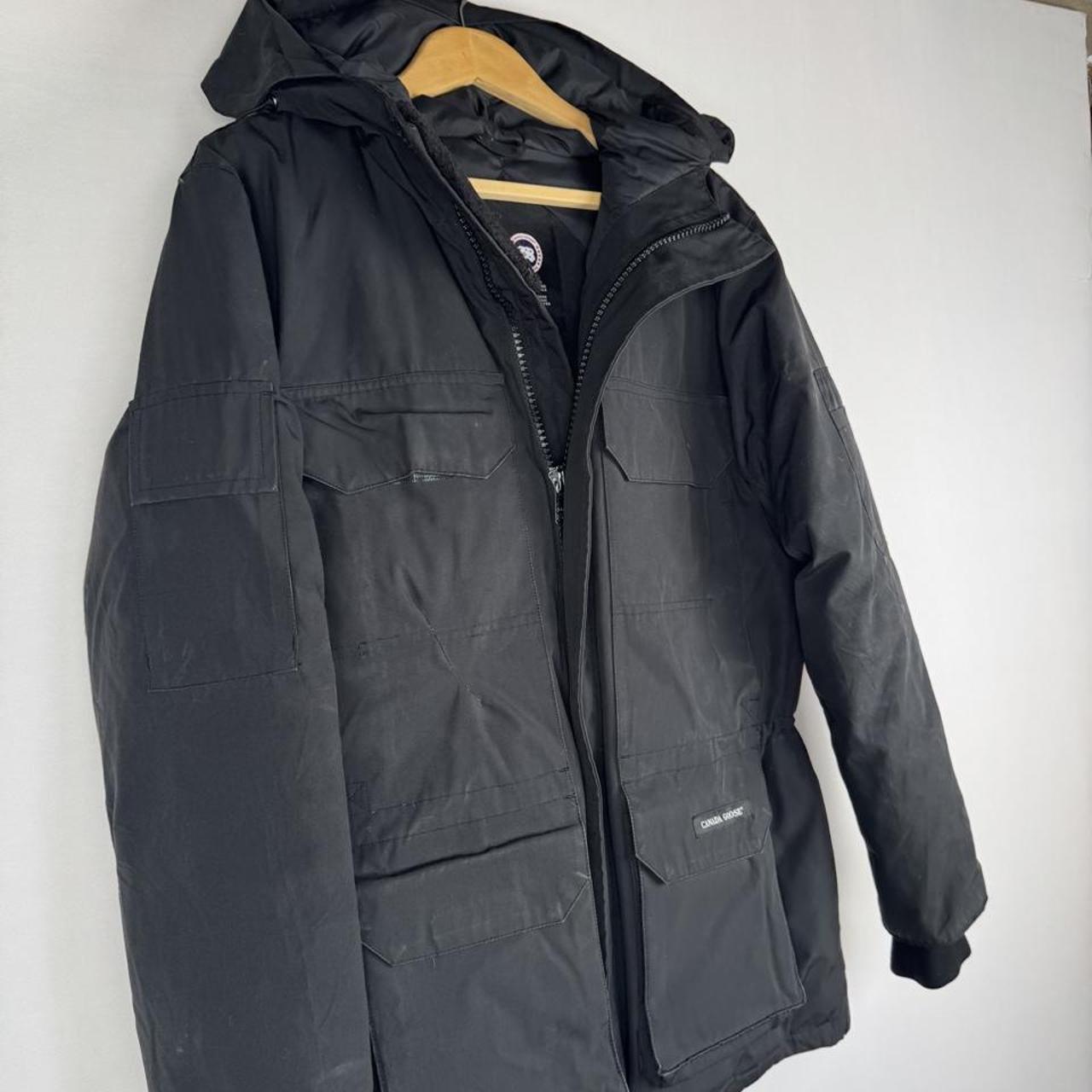 Canada Goose black parka jacket oversized fit with utility pockets and logo patch.