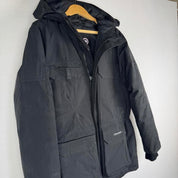 Canada Goose black parka jacket oversized fit with utility pockets and logo patch.