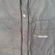 Canada Goose black down puffer gilet with logo patch and quilted texture.