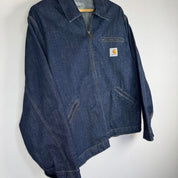 Carhartt WIP blue denim jacket with logo patch and classic design details.