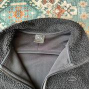 Oakley fleece jacket in cream with embroidered spellout logo and soft sherpa texture.