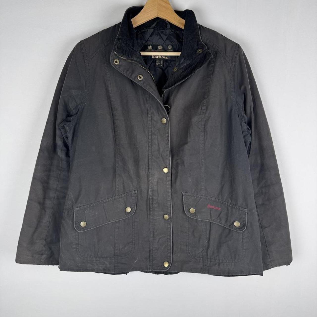 Barbour black women's winter jacket with logo detail and slim fit design.