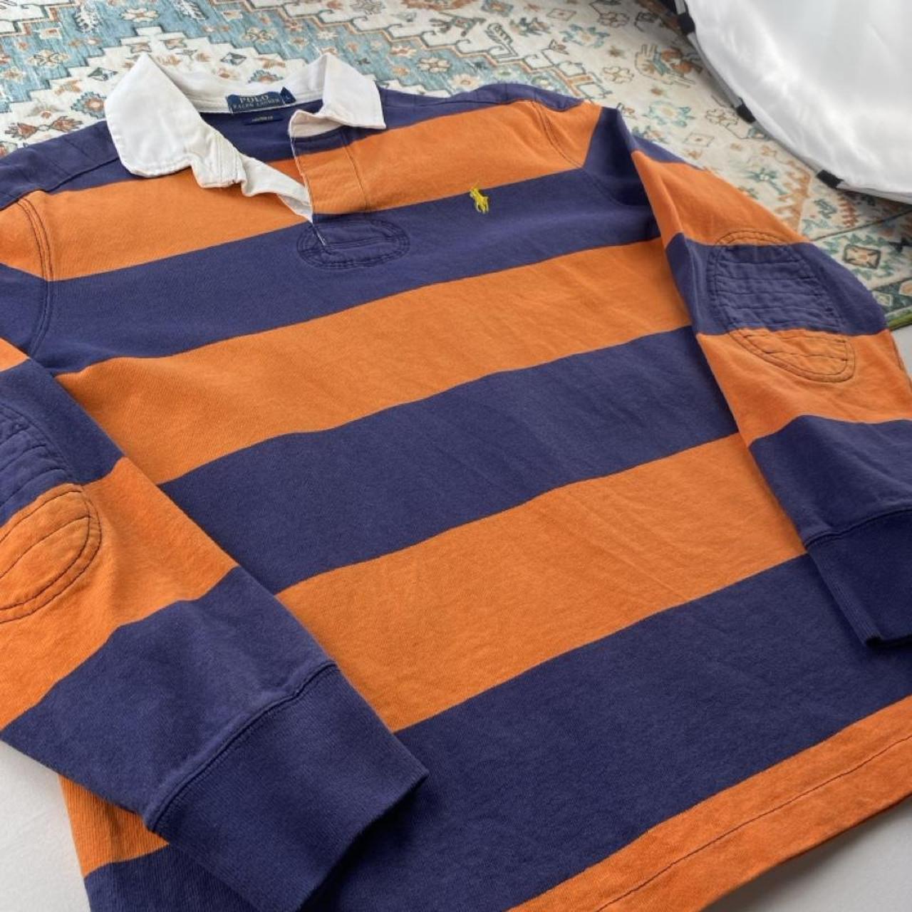 Polo Ralph Lauren navy and orange rugby polo shirt with thick stripes and embroidered logo.