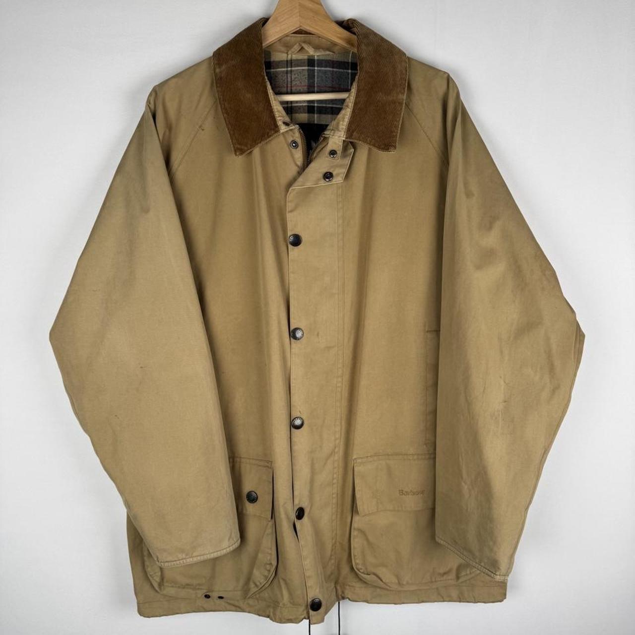 Barbour cream jacket with coated cotton, classic design, relaxed fit, visible marks.