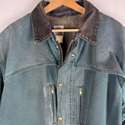 Carhartt oversized chore jacket in brown with classic logo patch and durable fabric.