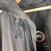 Canada Goose battered jacket black with no fur, badge, or visible holes.