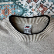 Nike cream knitted jumper with embroidered logo and visible marks from the 1990s.