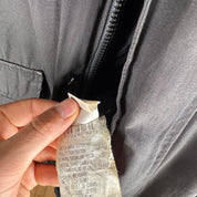 Canada Goose battered jacket black with no fur, badge, or visible holes.
