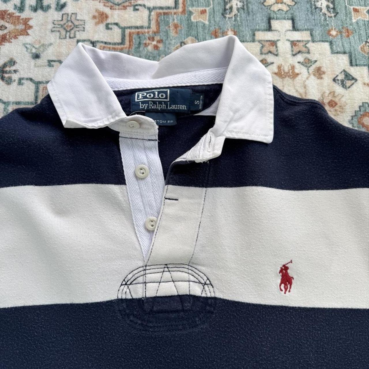 Polo Ralph Lauren navy rugby polo shirt with thick stripes and embroidered logo.