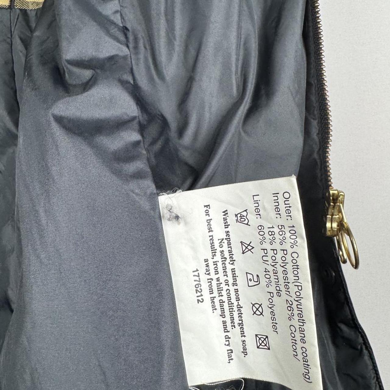 Barbour cream lightweight jacket with logo detail and slim fit design.
