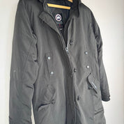 Canada Goose black parka jacket, medium size, features logo patch and sleek design.