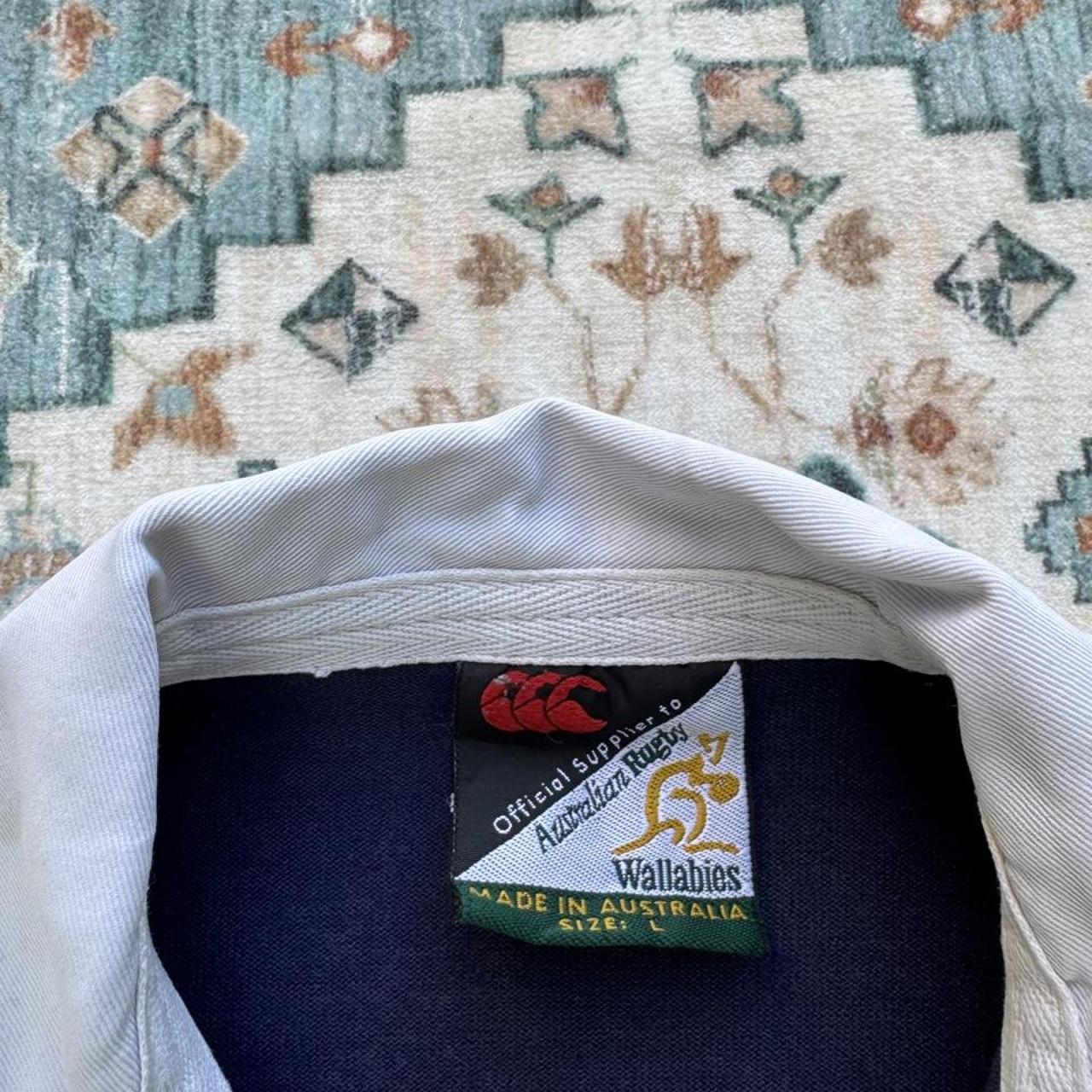 Canterbury men's long sleeve rugby polo green with Australia Wallabies logo and embroidered details.