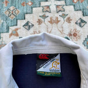 Canterbury men's long sleeve rugby polo green with Australia Wallabies logo and embroidered details.