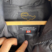 Canada Goose black down puffer gilet with logo patch and quilted texture.