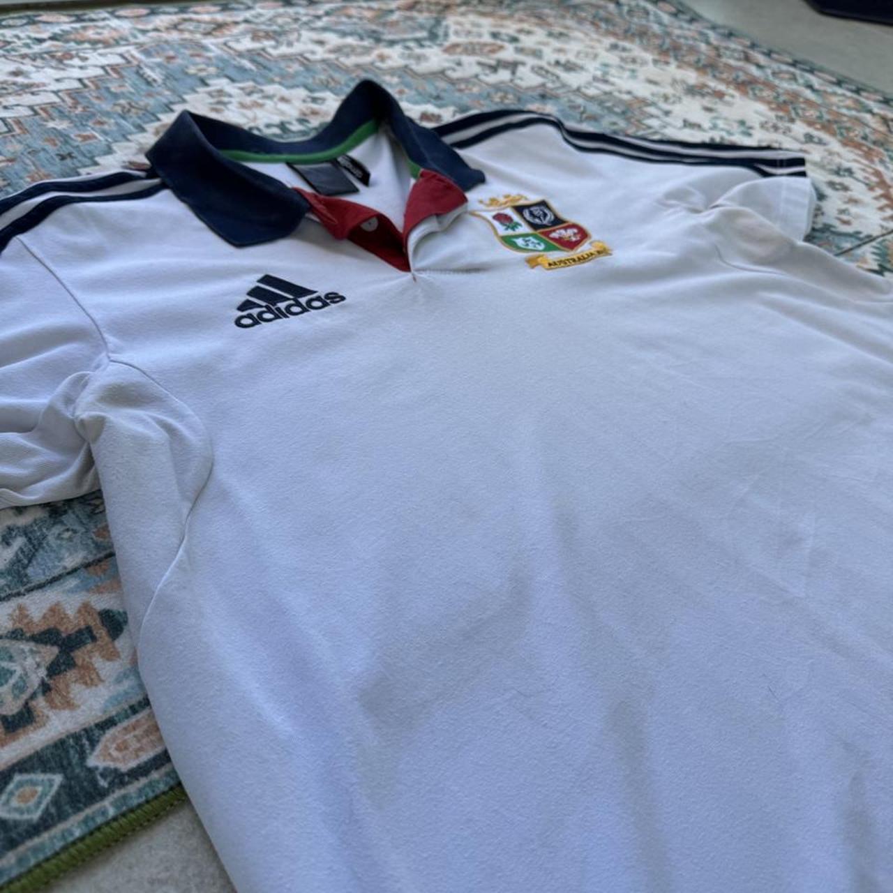 Adidas men's polo shirt red with British and Irish Lions logo and embroidered details.