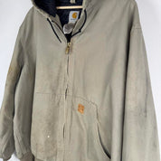 Carhartt active jacket, orange, oversized fit, visible logo, durable material.