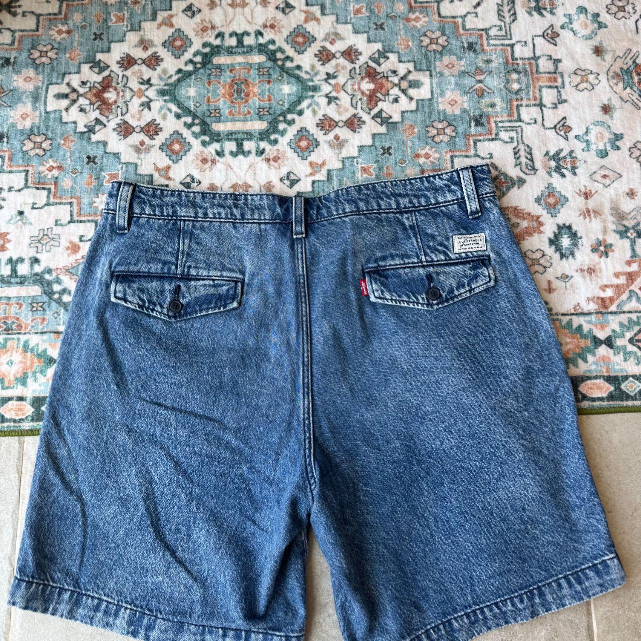 Levi's relaxed chino denim shorts in blue, featuring classic logo patch and clean design.