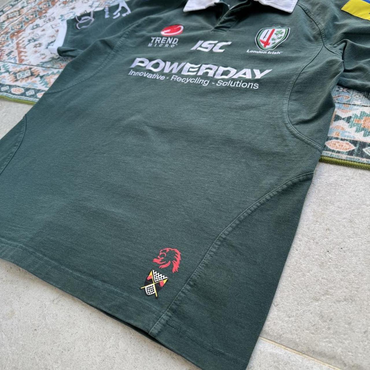 ISC green rugby polo shirt with embroidered London Irish logo and slim fit.