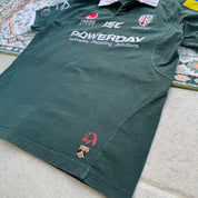 ISC green rugby polo shirt with embroidered London Irish logo and slim fit.
