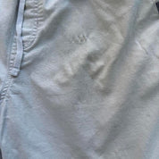 Quiksilver cream cargo shorts with embroidered logo and front pockets.