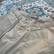 Quiksilver cream jorts with classic logo patch and vintage style from early 2000s.