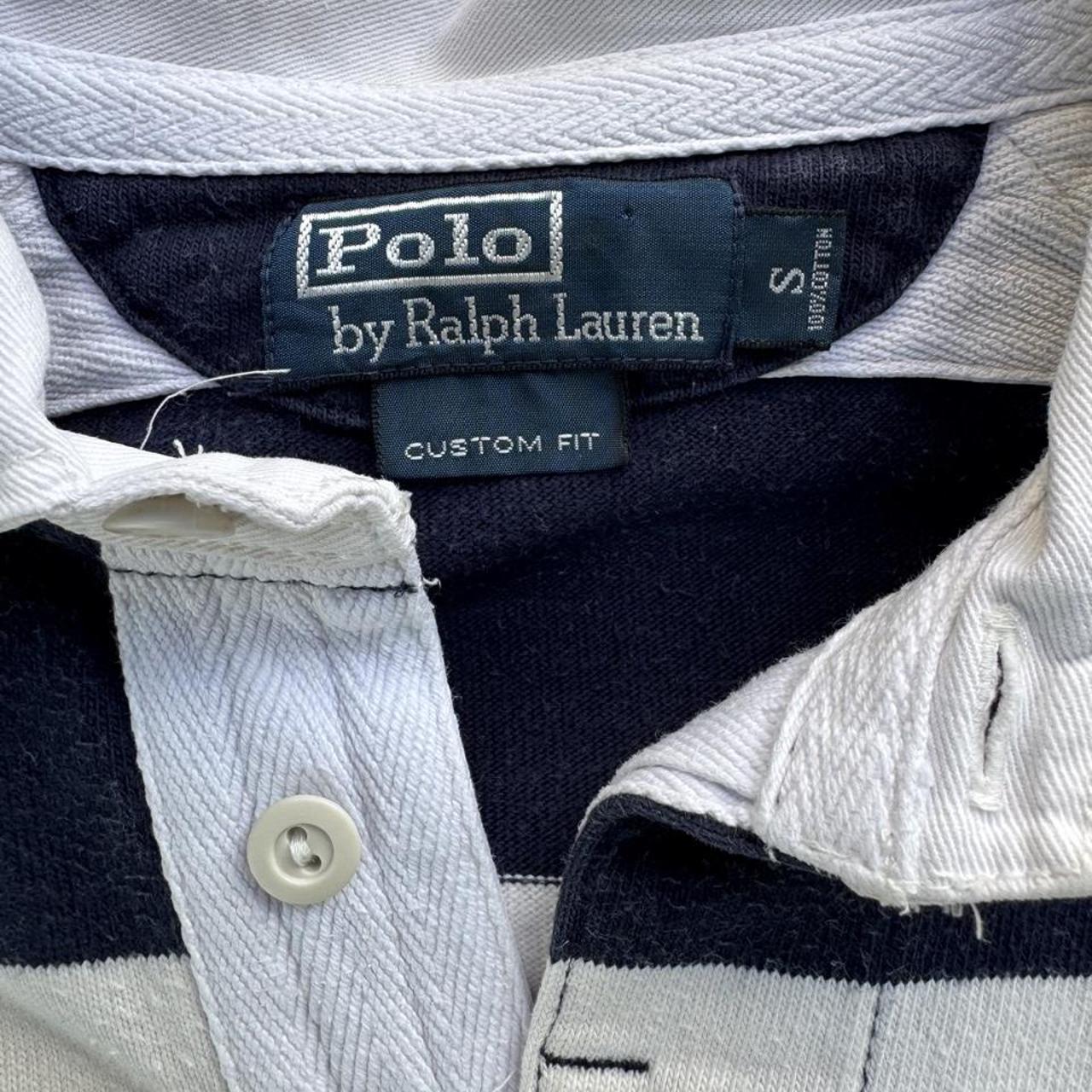 Polo Ralph Lauren navy rugby polo shirt with thick stripes and embroidered logo.