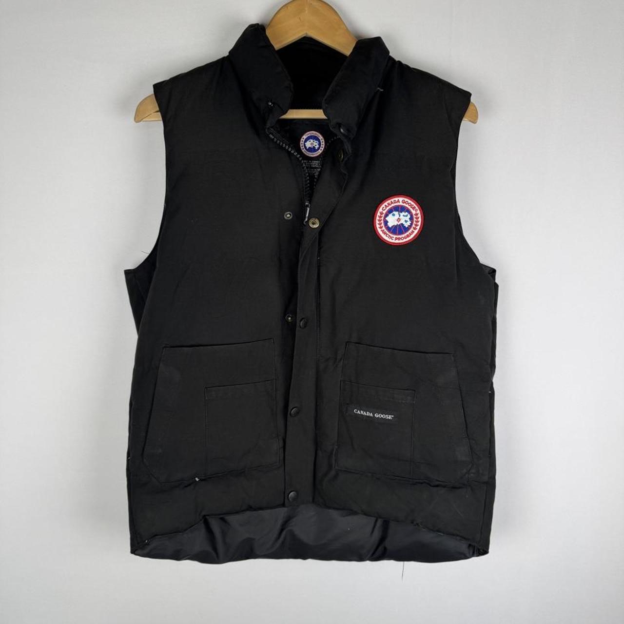 Canada Goose black puffer gilet with logo patch and quilted design.