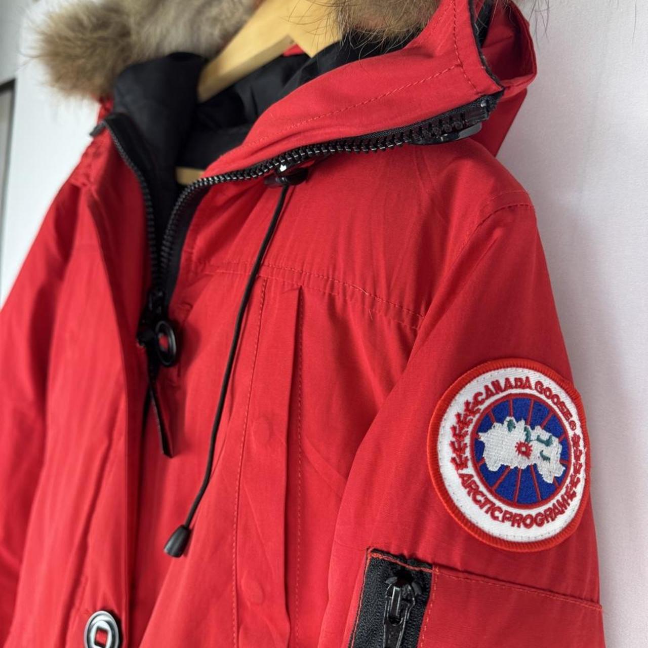 Canada Goose black Montebello parka jacket with fur-lined hood and logo patch.