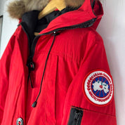 Canada Goose black Montebello parka jacket with fur-lined hood and logo patch.
