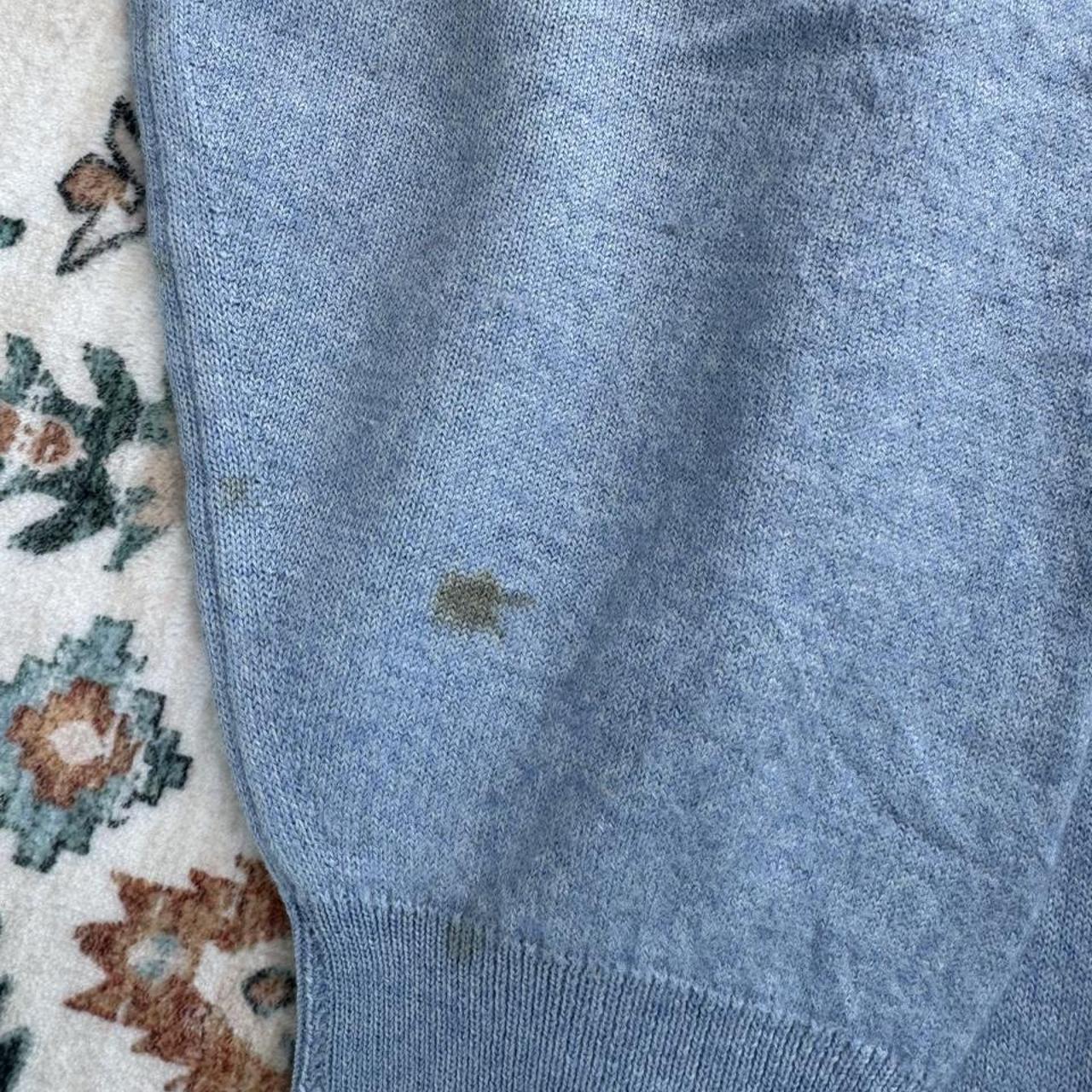 Burberry light blue knitted jumper featuring iconic check pattern and soft merino wool.