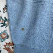 Burberry light blue knitted jumper featuring iconic check pattern and soft merino wool.