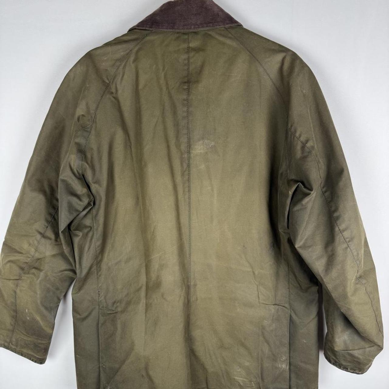 Barbour green wax jacket with logo, classic design, and durable material.