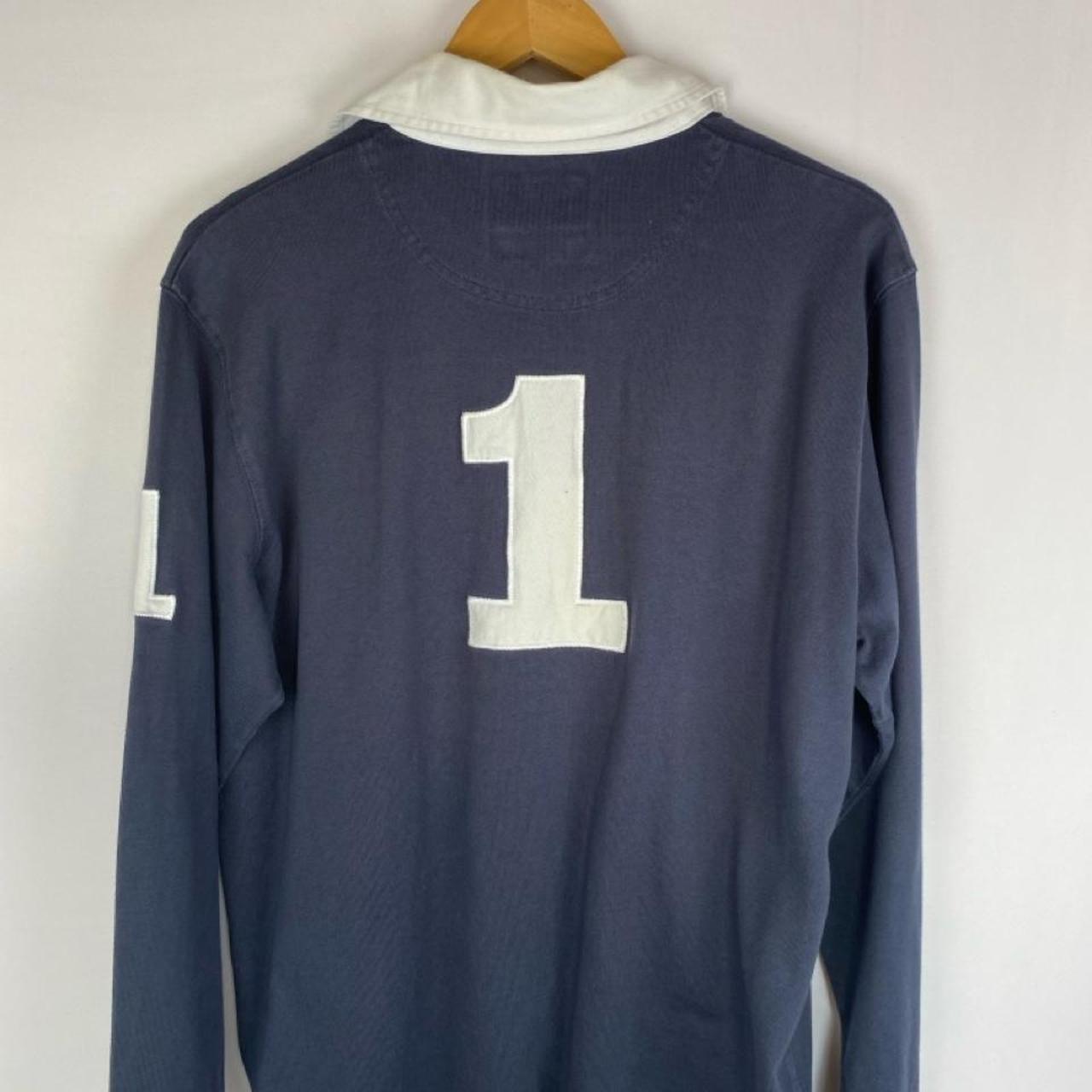 Hackett navy and white rugby polo shirt with spellout logo and thick fabric.