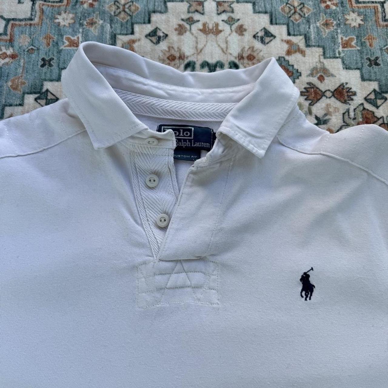 Polo Ralph Lauren white rugby polo shirt with embroidered logo and thick fabric.