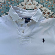 Polo Ralph Lauren white rugby polo shirt with embroidered logo and thick fabric.