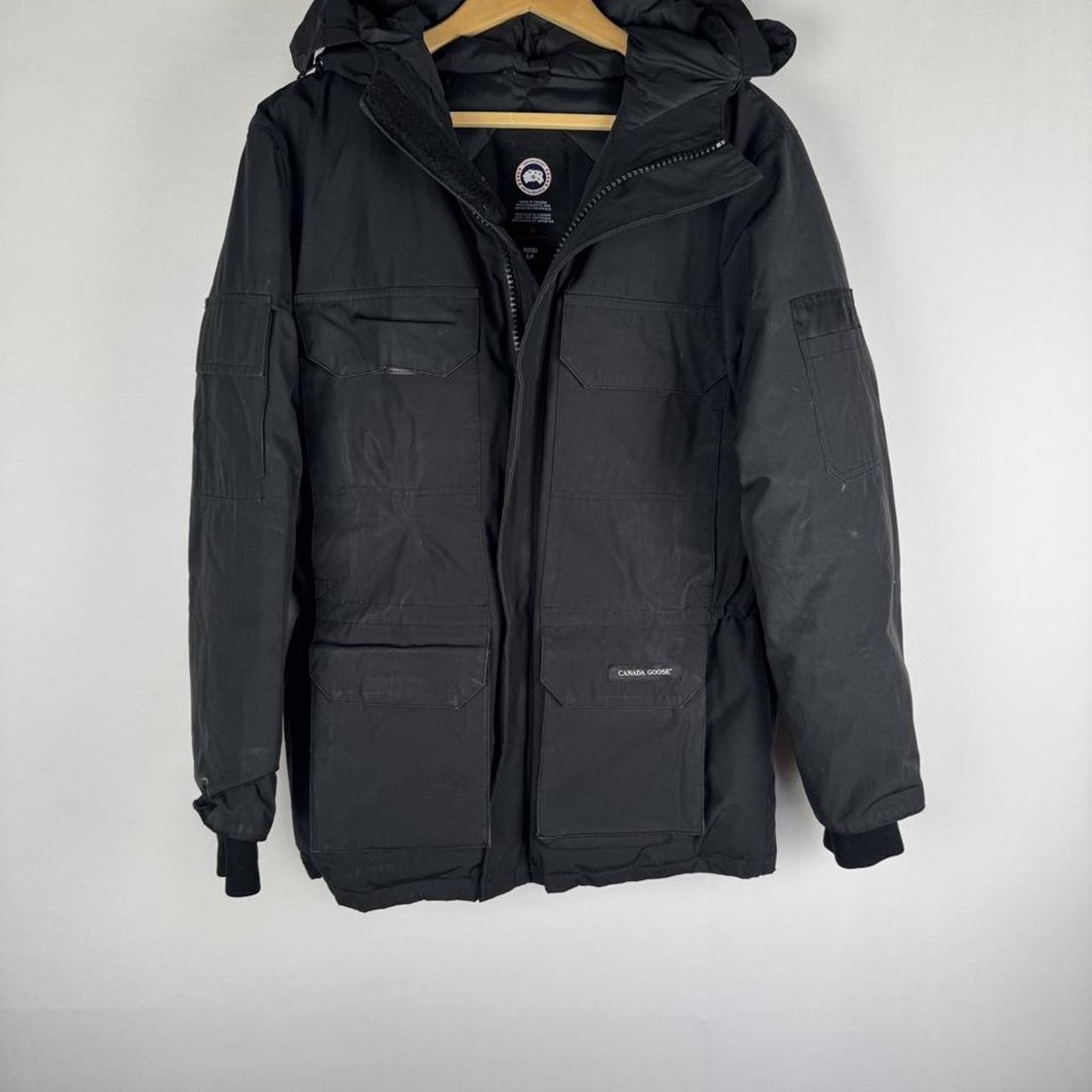Canada Goose black parka jacket oversized fit with utility pockets and logo patch.