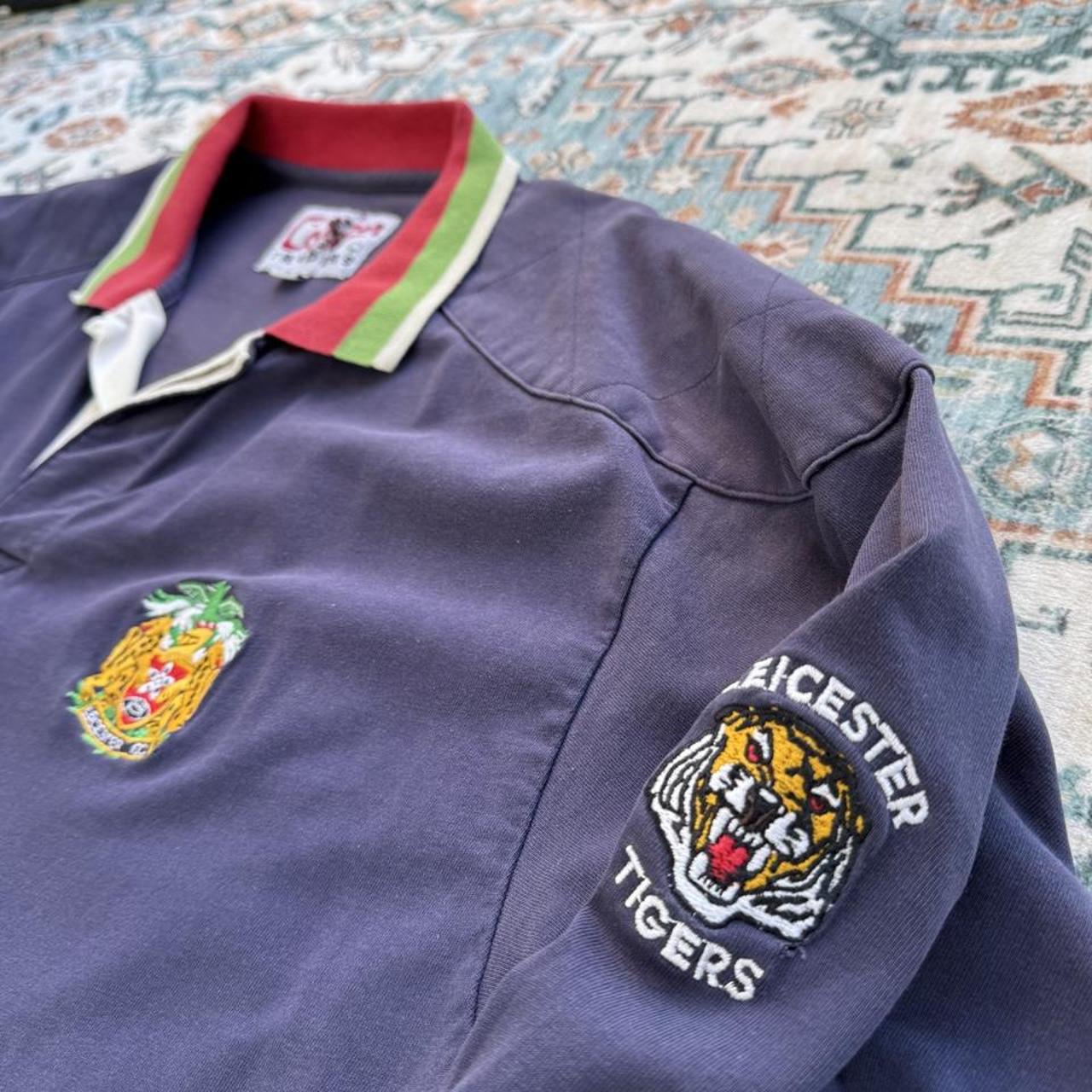 Cotton Traders men's rugby polo shirt, navy with fading, featuring Tigers logo and cotton material.