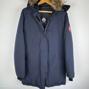 Canada Goose navy parka jacket with logo patch and fur-lined hood.