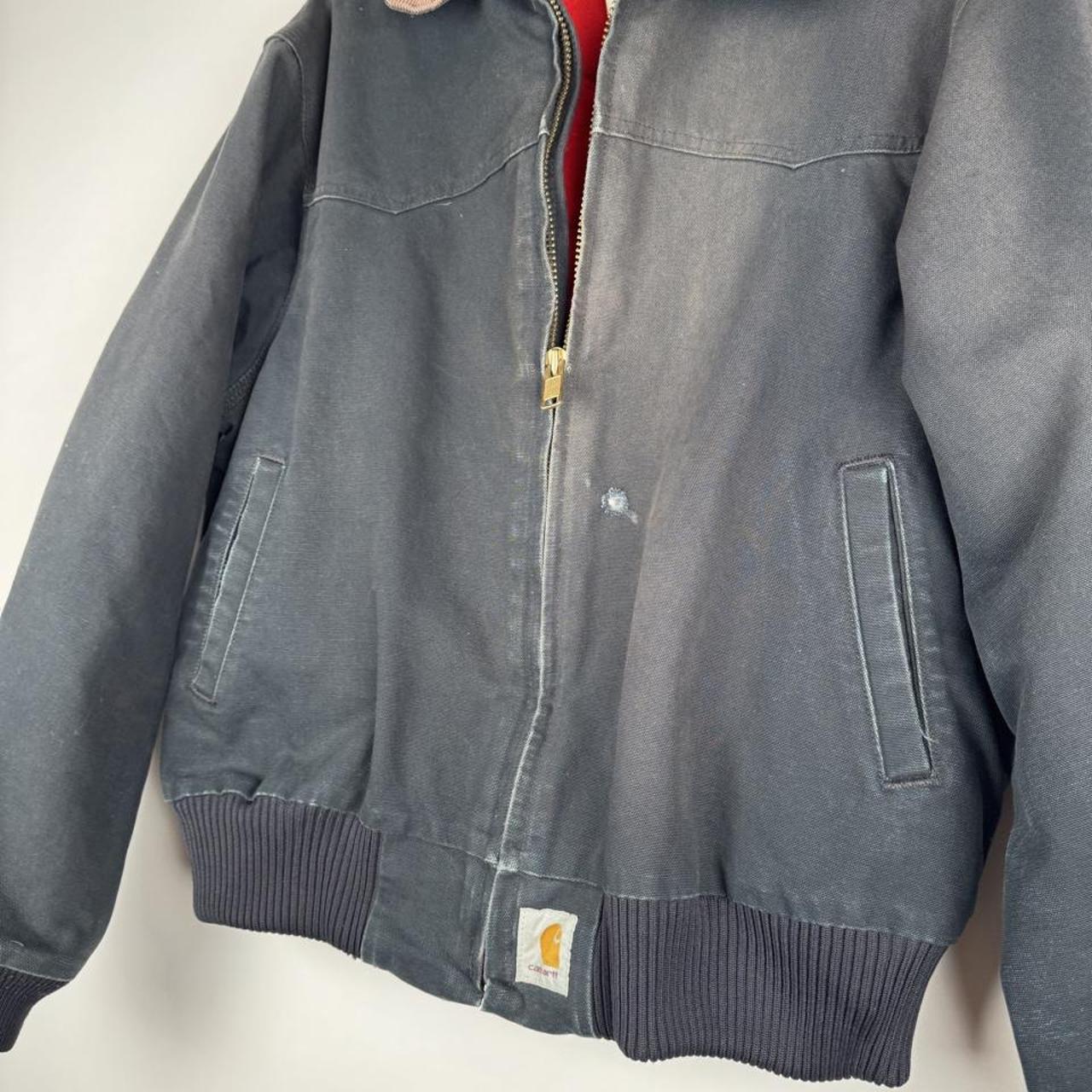Carhartt cream jacket featuring thick fabric and oversized fit with Santa Fe design.