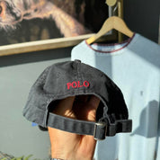 Polo Ralph Lauren black and red cap with embroidered logo and adjustable strap.