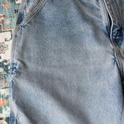 Carhartt denim baggy shorts blue with classic logo and carpenter pockets.