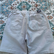 Quiksilver cream cargo shorts with embroidered logo and front pockets.