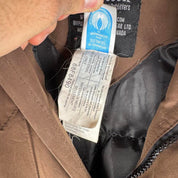 Canada Goose brown parka jacket with logo patch and utility pockets.
