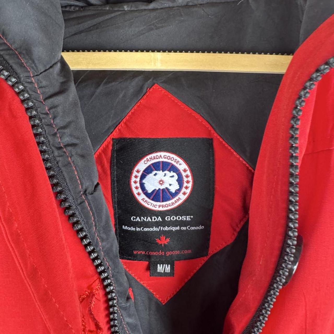 Canada Goose black Montebello parka jacket with fur-lined hood and logo patch.