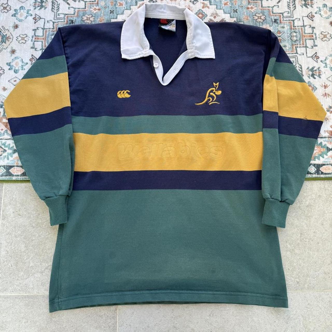Canterbury men's long sleeve rugby polo green with Australia Wallabies logo and embroidered details.