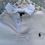 Polo Ralph Lauren cream rugby polo shirt with embroidered logo and classic collar.