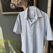 Yves Saint Laurent short sleeve button down shirt blue embroidered YSL logo.