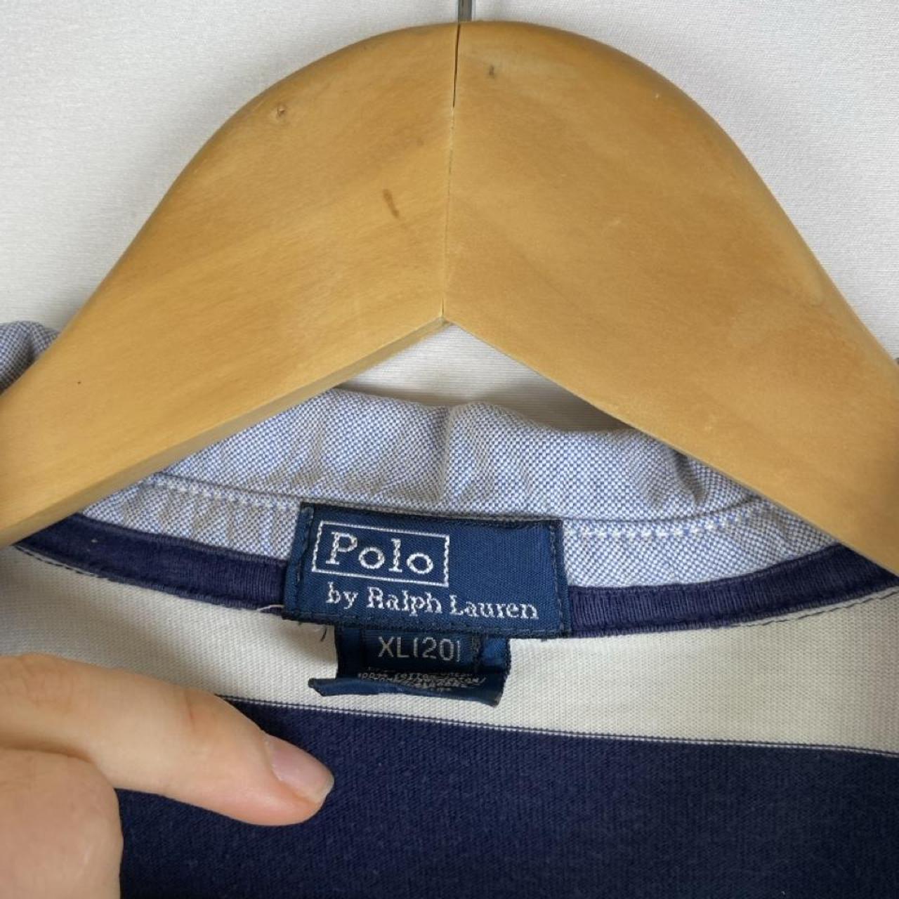 Polo Ralph Lauren blue and navy striped rugby polo shirt with logo detail.