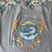 Billabong oversized graphic t-shirt blue with cream and green patterns, featuring pocket detail.
